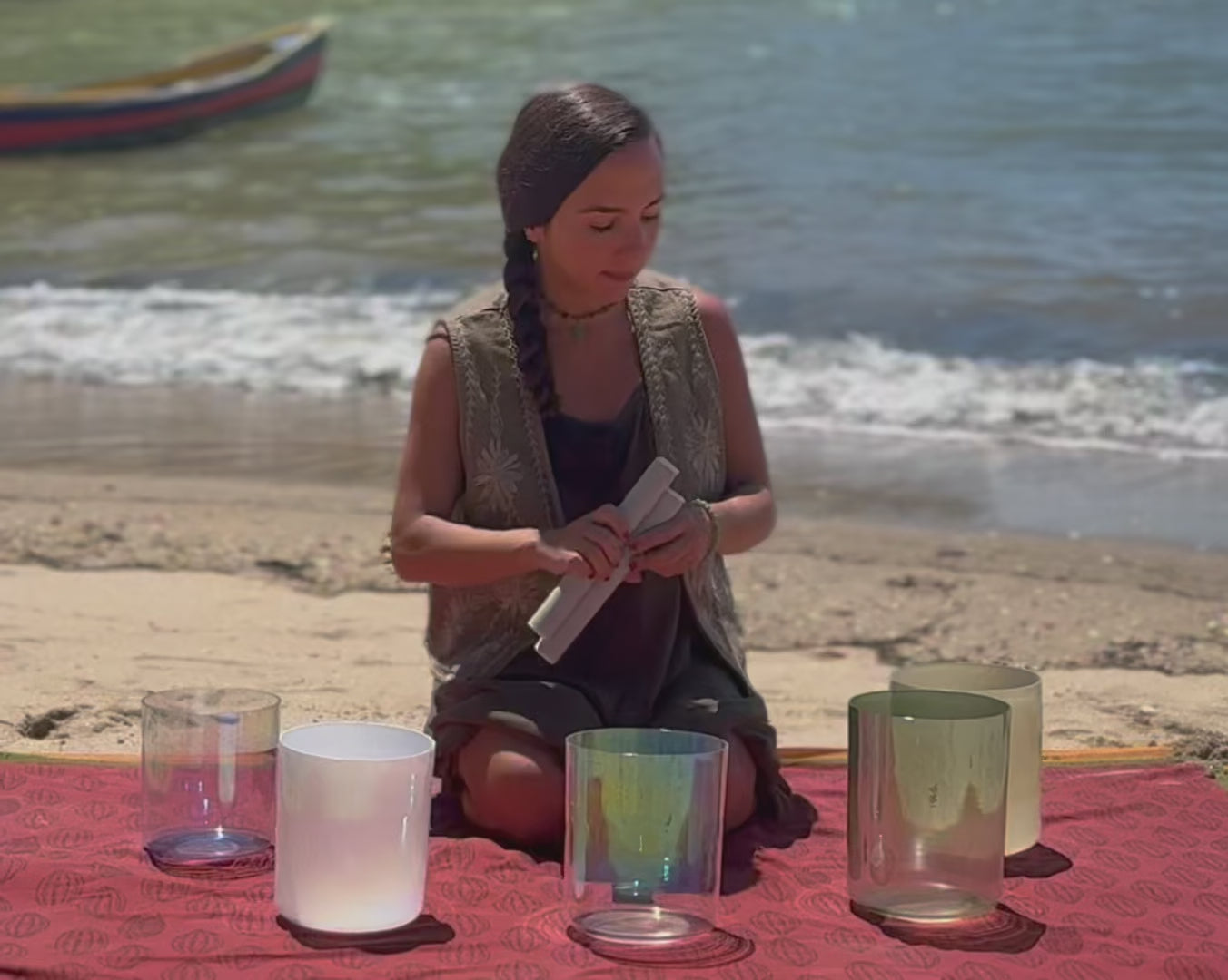 Terratone quartz crystal singing bowls being played by the ocean in a sound healing session