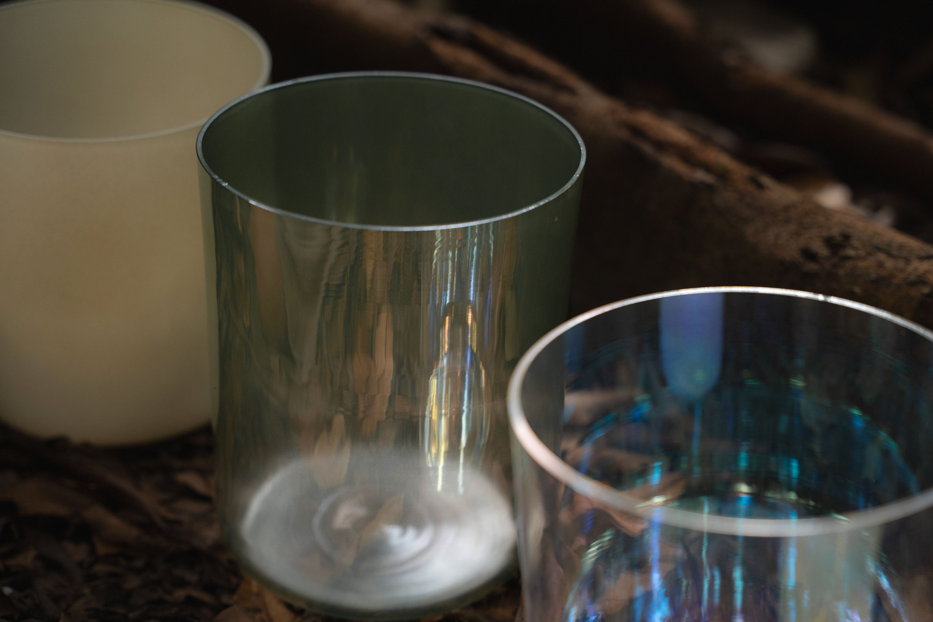 Close-up of Terratone crystal singing bowls with earthy tones and natural textures.