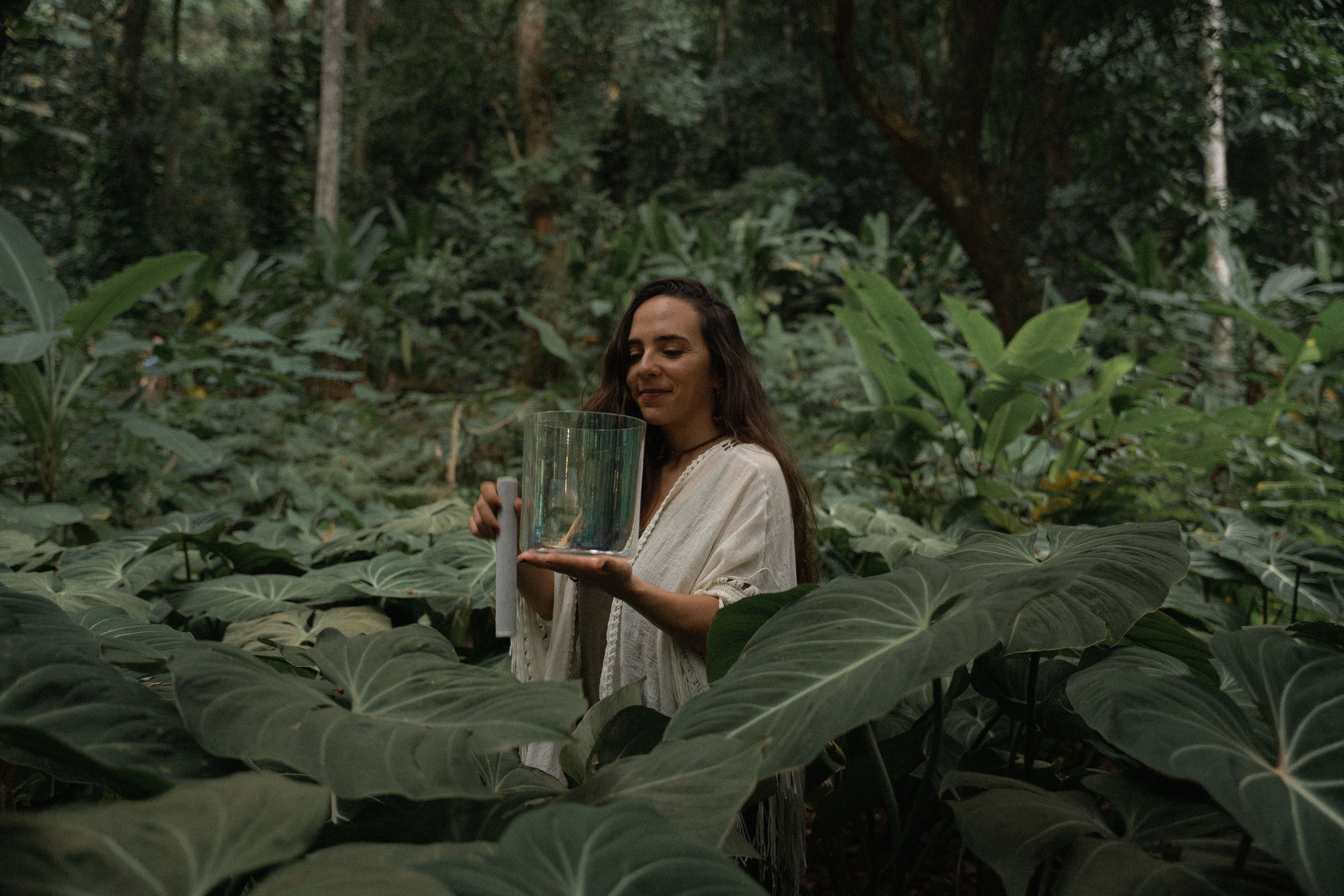Terratone crystal singing bowl held in nature during grounded sound healing practice